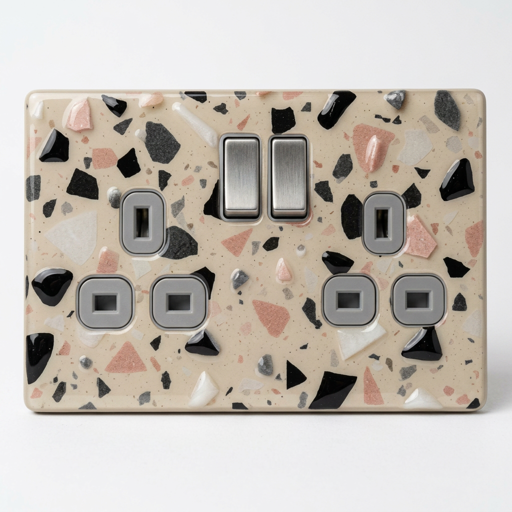 Cream terrazzo with black and pink chips UK double socket and switch plate